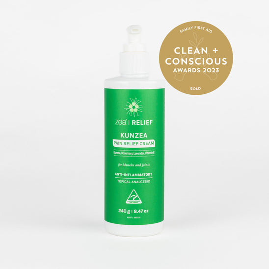 Green bottle of Kunzea Pain Relief Cream with 'Clean + Conscious' award badge on a white background