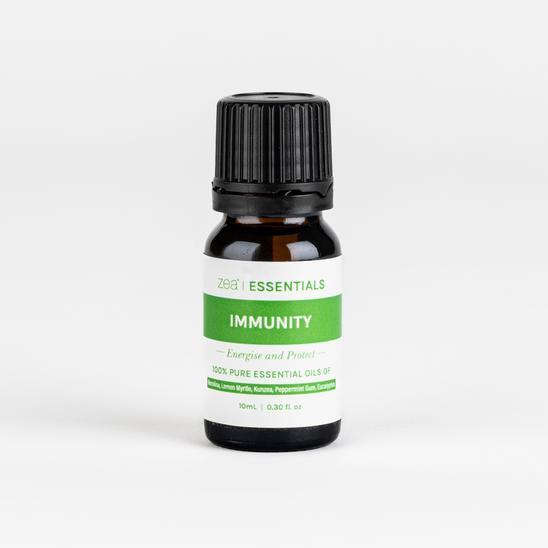 A bottle of Immunity Lifestyle Blend essential oil with a white label displaying the words '_IMMUNITY', 'Energise and Protect', and the Zea Essentials logo.